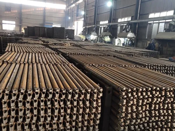 Raw steel tubes staged in the workshop